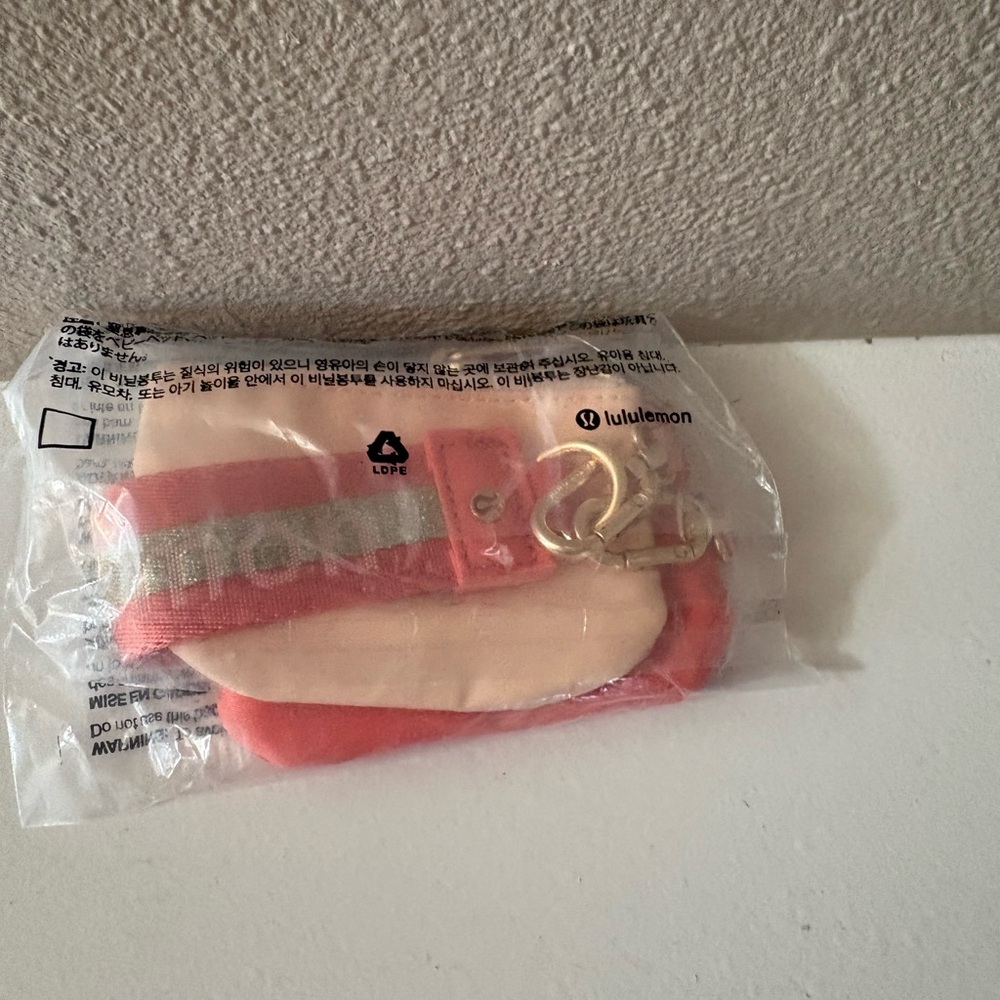 NWT lululemon athletica Pink and Cream dual pouch wristlet
